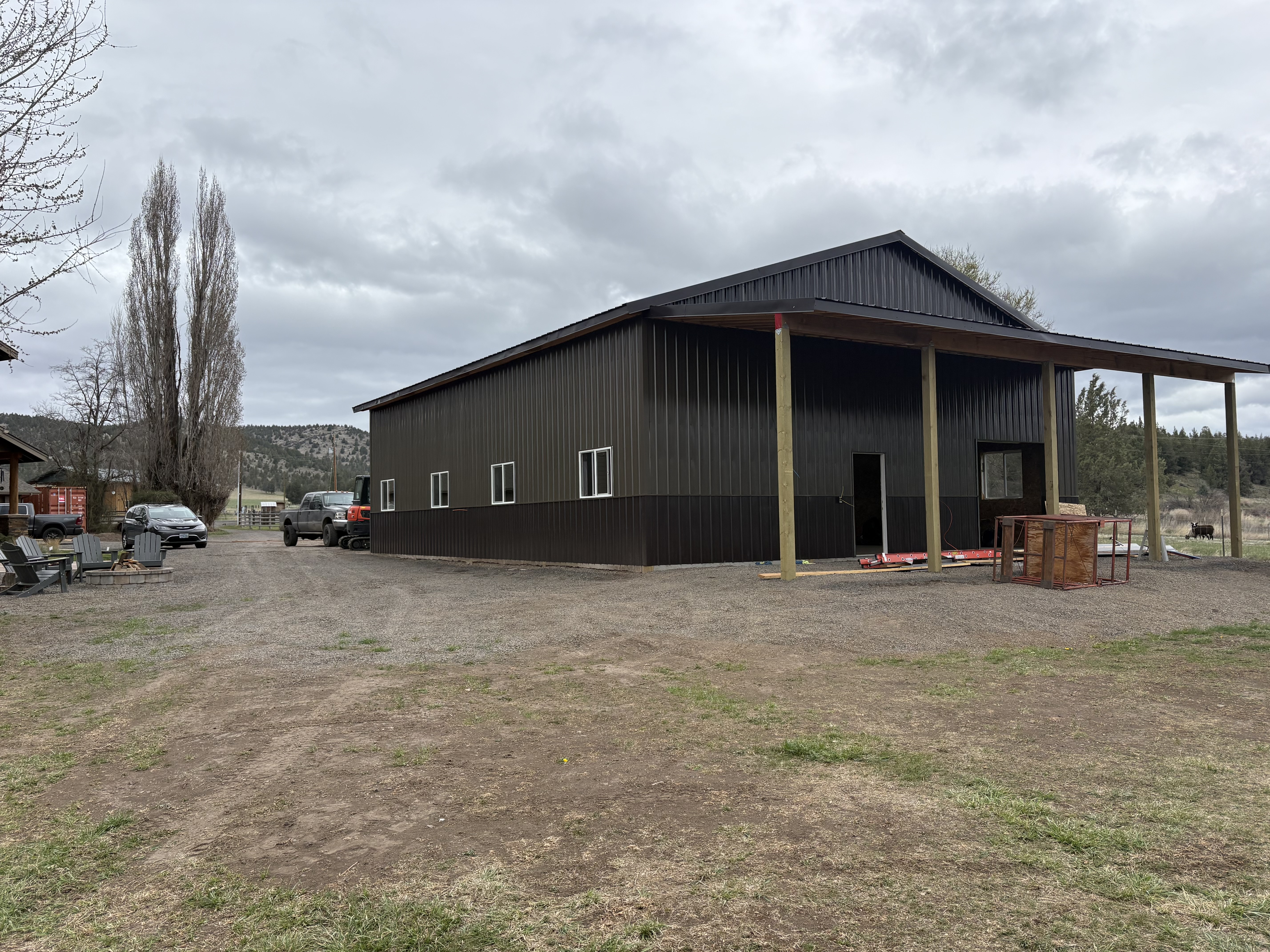 MCM customer build — weathered copper siding with dark brown wainscot